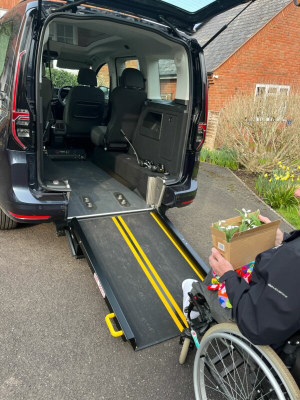 Brian wheels into the Caddy with a box of snowdrops