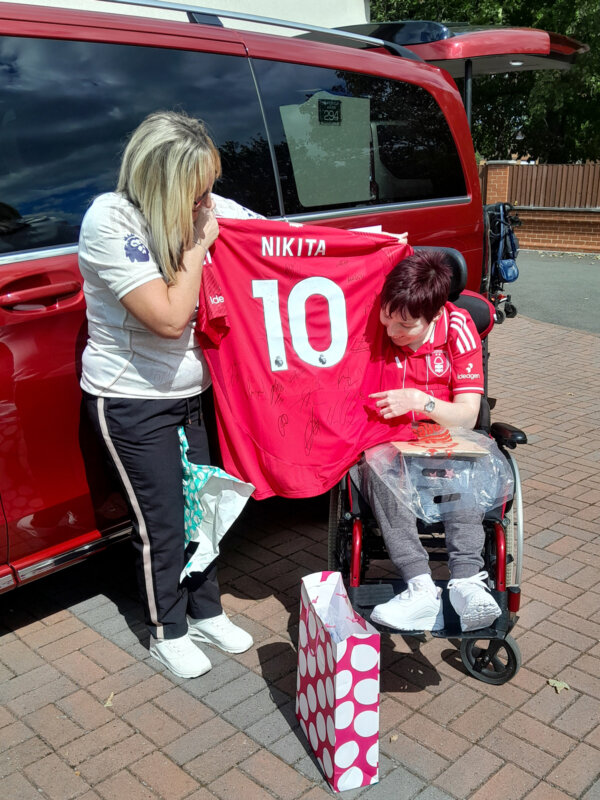Nikita with her Signed NFFC Shirt